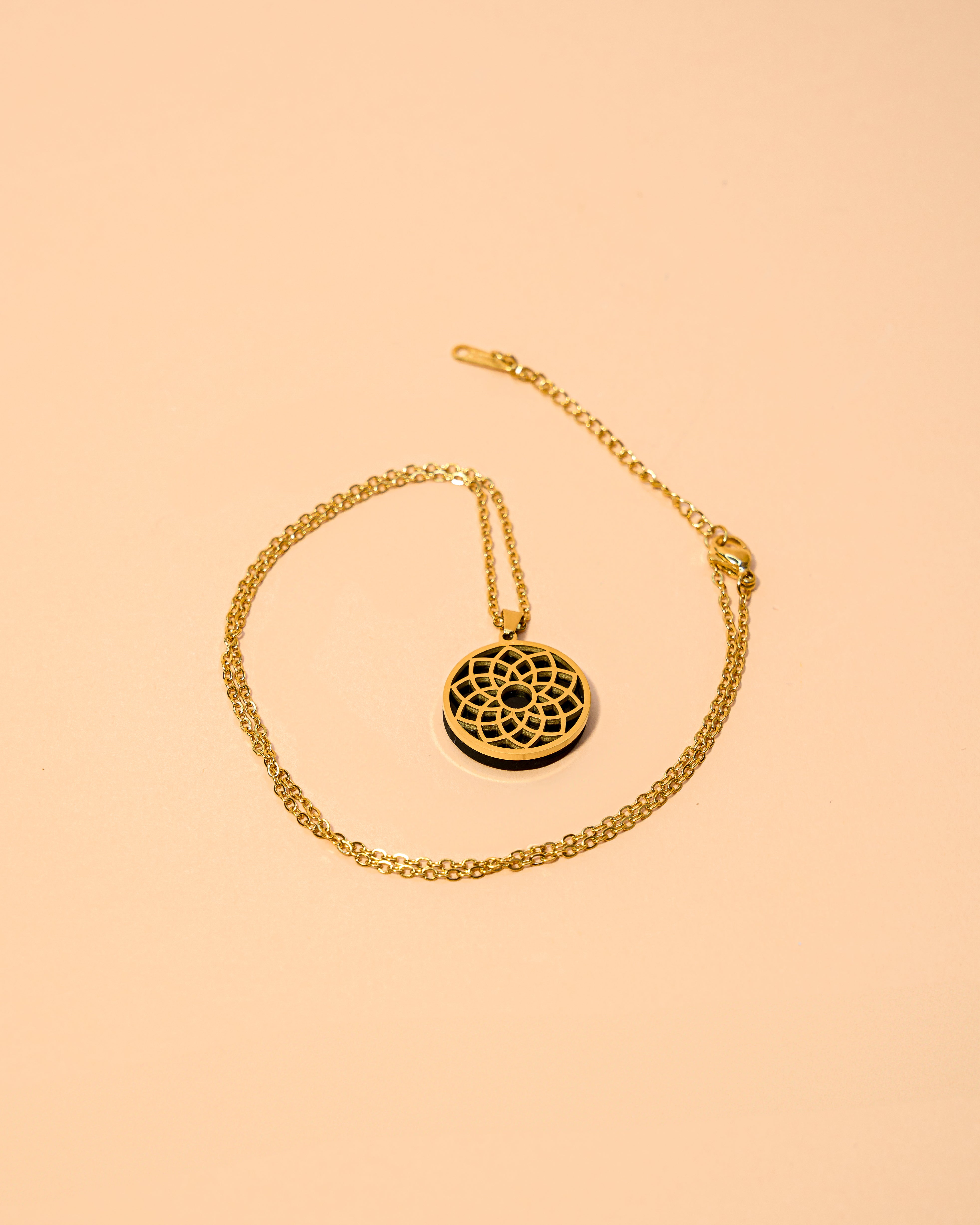COLGANTE DE ACERO CHACRA CORONA SHASRARA CON SHUNGUITA Y CADENA