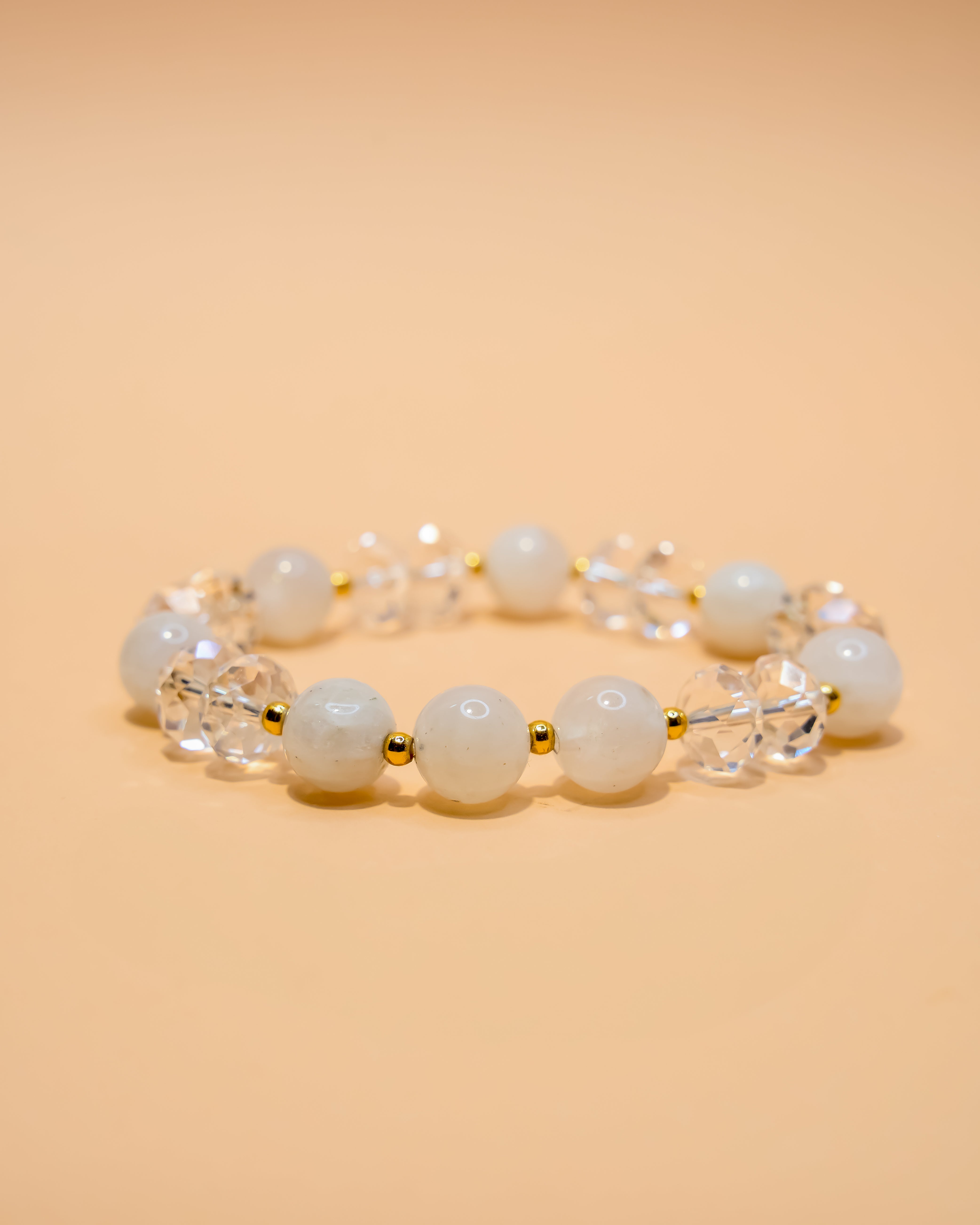 Moonstone bracelet with faceted quartz crystal